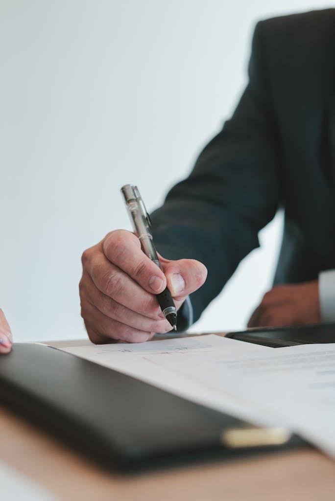 A Focus on Hand Writing and Wearing a Suit 